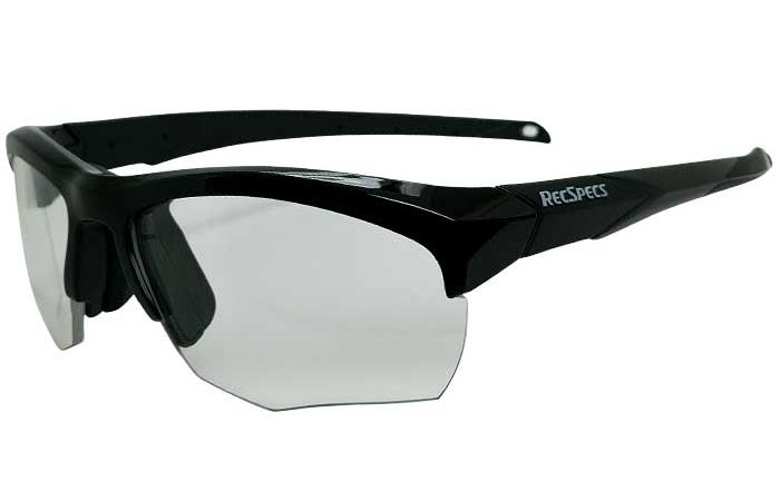 A pair of black athletic sports glasses, called the RecSpecs Impact, with clear lenses and the brand name "RecSpecs" on the frame. The glasses have a wrap-around design for full coverage protection and a sleek, modern look.