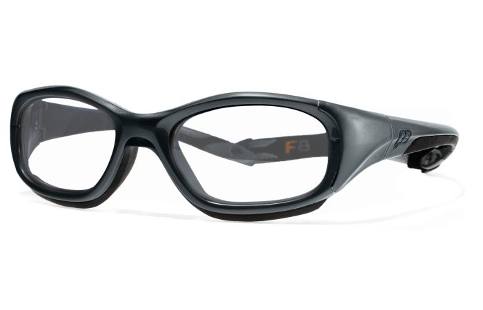 A pair of black RecSpecs Slam XL protective sports glasses with clear lenses. The glasses have a thick, durable frame designed to withstand impact, and feature a wrap-around style for secure fit and coverage. The side temple has an insignia for the brand RecSpecs.