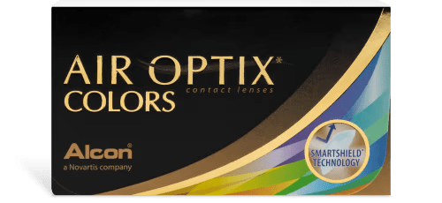 A black box of AIR OPTIX® Colors color contact lenses with gold and rainbow accents, featuring the Alcon logo. The box also highlights "SmartShield® Technology" in a blue and gold emblem.