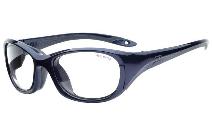 A pair of dark blue, wraparound protective glasses with clear lenses and a sleek, sporty design. The left temple is embossed with a subtle RecSpecs logo, and there's a small cutout near the end. The frame features a rounded shape that provides full eye coverage and meets impact resistance standards. Introducing the RecSpecs - All Pro XL.