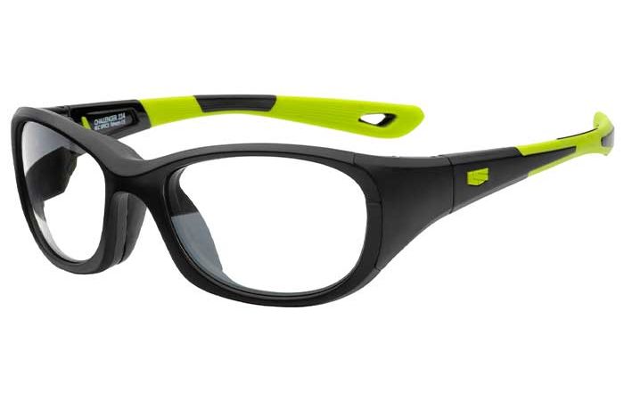 A pair of RecSpecs - Challenger XL glasses by RecSpecs with a black frame and lime green accents on the temples. Featuring impact-rated lens retention, the lenses are clear, and the temples have a combination of black and green with textured grips near the ends. The durable design ensures stylish vision protection.