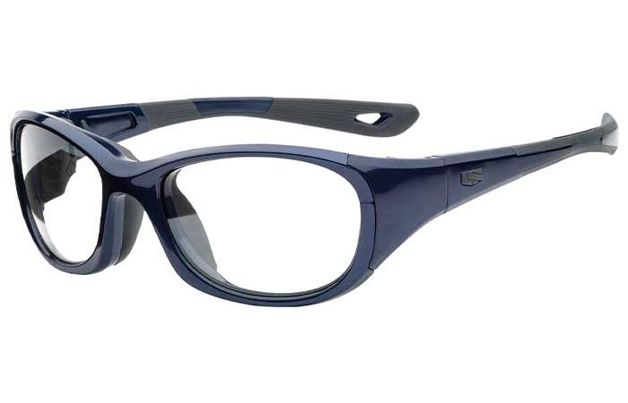 The RecSpecs - Challenger XL by RecSpecs is a pair of safety glasses with dark blue frames and clear lenses. The temples are shaped for a secure fit and have black rubber inserts for added comfort. With impact-rated lens retention, this protective eyewear boasts a sporty design, providing both vision protection and style.
