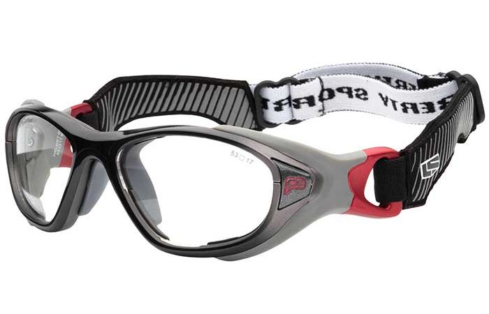 A pair of RecSpecs Helmet Spex sports goggles with clear lenses and a black and red frame. The adjustable elastic strap, black with white sections, features printed text for a secure fit during athletic activities. These goggles meet impact resistance standards for optimal safety.