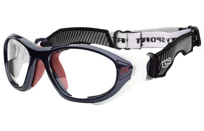 RecSpecs Helmet Spex XL with a black and white adjustable strap and clear lenses. The predominantly black frame features white and red accents, designed to meet impact resistance standards. Padding on the nose bridge and sides ensures comfort and protection, ideal for helmet sports like the RecSpecs Helmet Spex XL.
