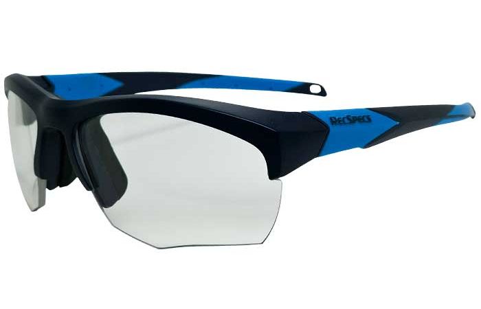 A pair of sporty, black and blue RecSpecs Impact protective glasses with a wrap-around design and partially rimless, clear lenses. The frame features blue accents on the temples, and "RecSpecs" branding is visible on the side.