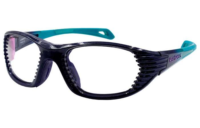 Clear safety glasses with a dark, sturdy frame and teal arms. The glasses have side guards and a textured design on the front and side frames, likely for added grip and protection. The word "RecSpecs Maxx Air" is printed on the side arm from RecSpecs.