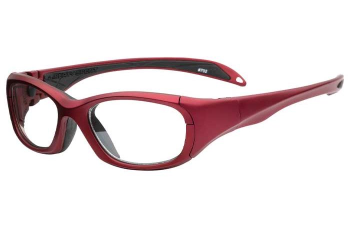 RecSpecs MS1000 sports safety glasses with clear lenses. The frame is robust, with thick arms for added durability. The inside of the frame and the temple tips are black, providing contrast to the red exterior. The glasses have an overall sleek, athletic design.