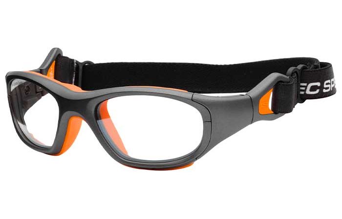 A pair of RecSpecs RS-41 protective sports goggles with grey and orange accents, clear lenses, and an adjustable black strap. The sides of the frame are reinforced, likely for impact resistance.