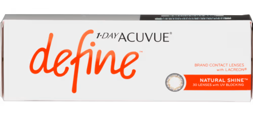 A box of Johnson & Johnson 1-Day Acuvue Define beauty-enhancing contact lenses. The box features the product name in bold orange letters and indicates that it contains 30 lenses with UV blocking and Lacreon technology. The specific lens type is labeled "Natural Shine.