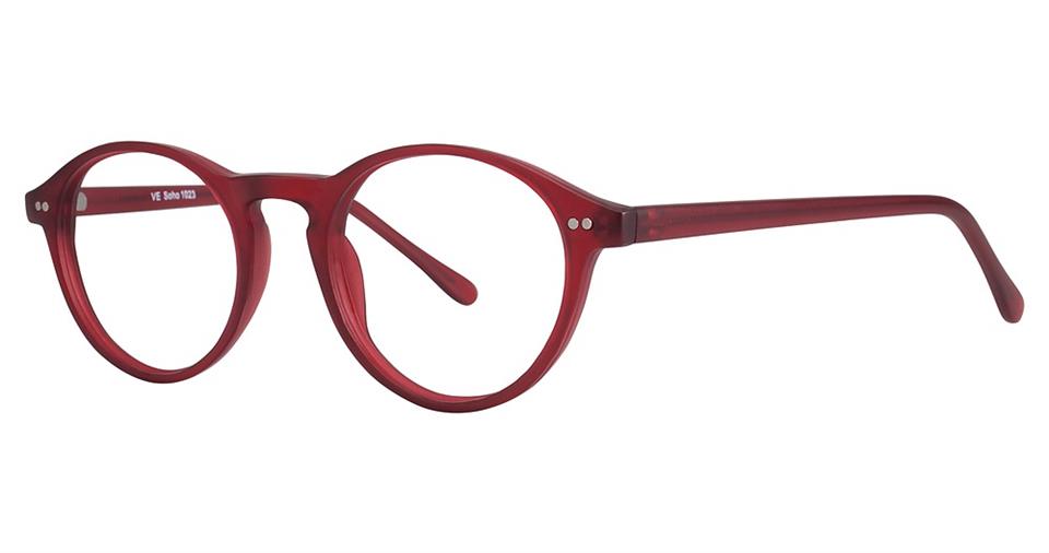 A pair of Vivid Soho 1023 eyeglasses with round, red, high-quality plastic frames, featuring thin temples and small silver accents near the hinges. The design is minimalistic yet stylish, combining a classic shape with a contemporary style.
