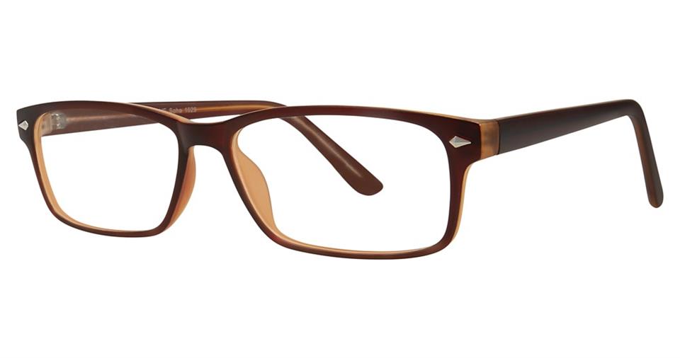 The Vivid Soho 1029 Eyeglasses are a pair of rectangular eyeglasses with a brown tortoiseshell frame made of high-quality lightweight plastic. The arms are slightly darker brown and taper towards the ends. With clear lenses and a subtle bridge in the same pattern, these eyeglasses make for a versatile accessory.