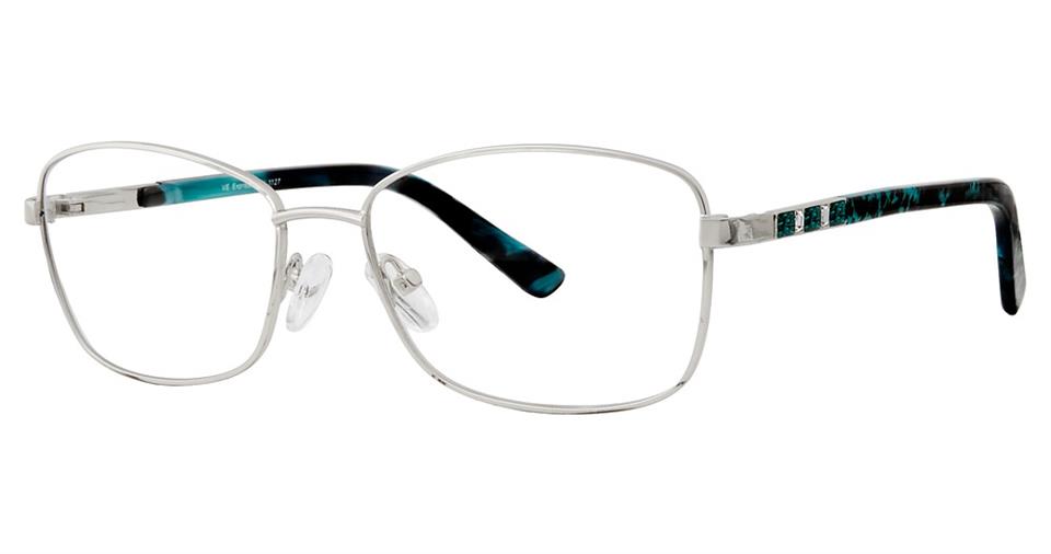 A pair of Vivid Expressions 1127 eyeglasses with silver, high-quality metal frames and rectangular lenses. The nose pads are adjustable, and the temple tips feature a blue and black marbled pattern. The thin arms add a sleek, modern touch to the design.