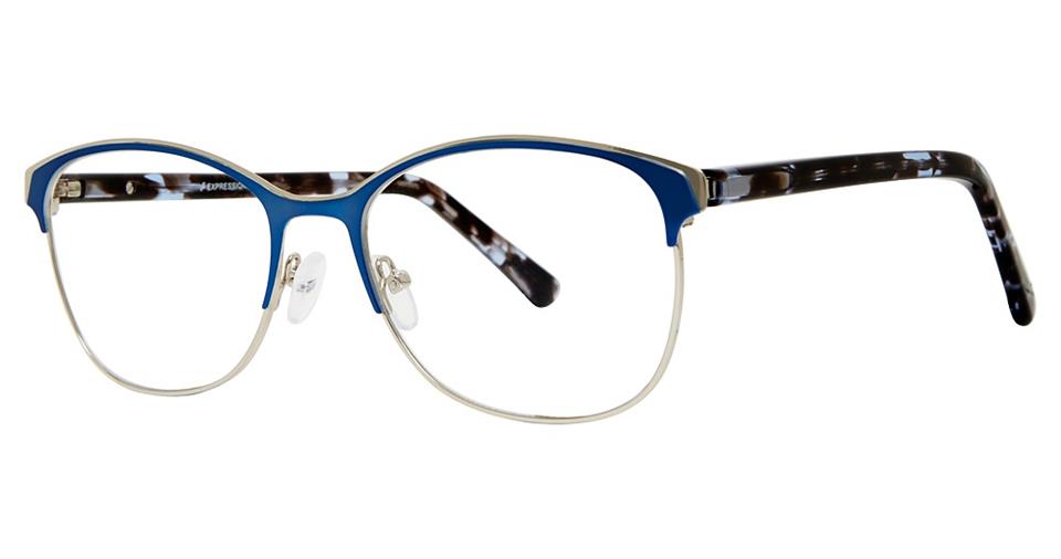 The Vivid Expressions 1128 eyeglasses boast a stylish, modern design with durable metal round blue rims and tortoiseshell-patterned arms. Clear nose pads and sleek bridge detailing add a contemporary touch to the overall frame.
