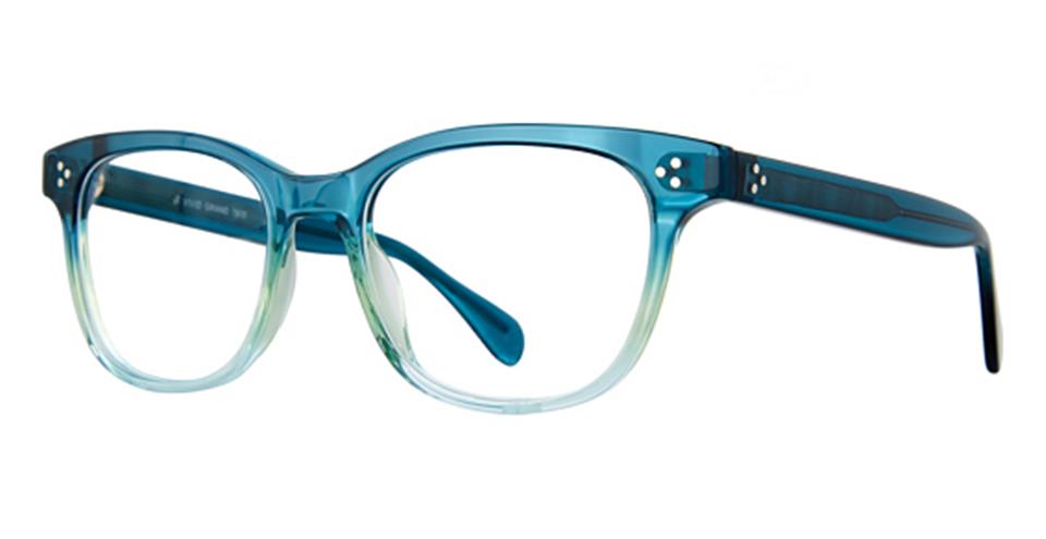 A pair of Vivid Grand 7503 eyeglasses with semi-transparent blue and green gradient frames. These versatile, stylish glasses boast a vintage-inspired design with rounded lenses and slightly thick, high-quality plastic frames. The arms are solid blue with two small metallic accents near the hinges.